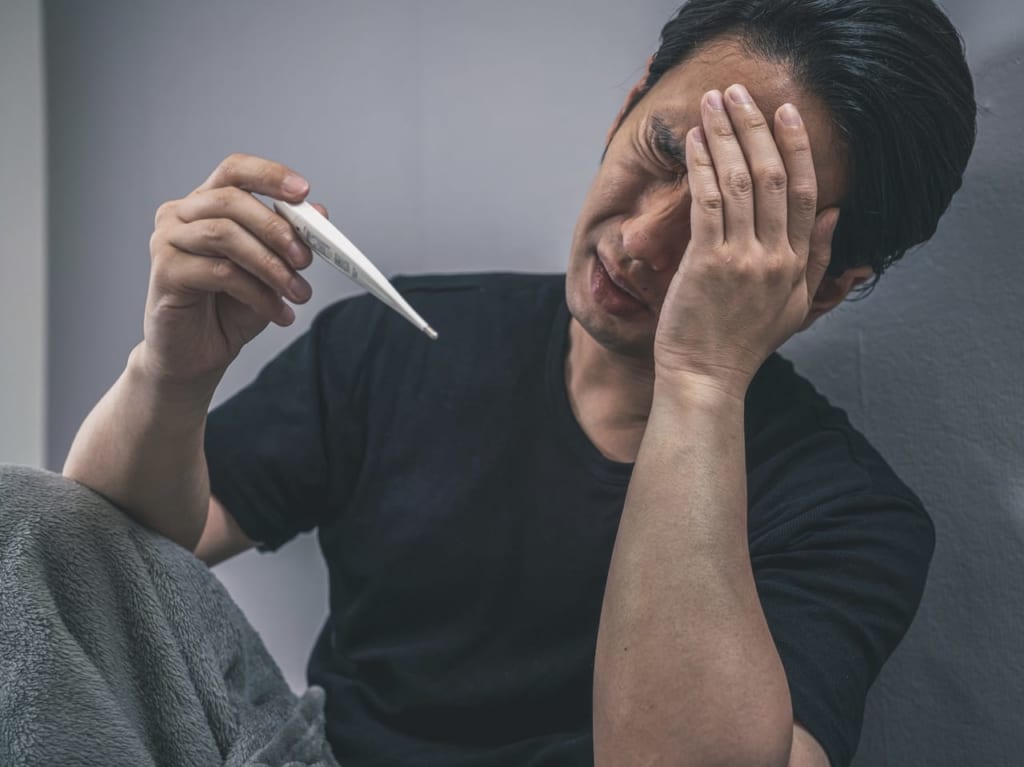 体調が悪い男性のイメージ画像
